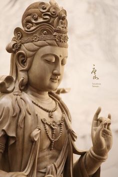 a buddha statue with the word peace written in chinese