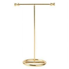 a gold plated metal stand with two bars on it