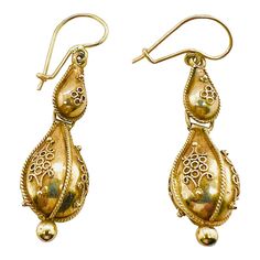 This is part of Chairish’s Fine Jewelry assortment.  A fine Victorian period pair of 14K gold earrings with French wires and hooks for pierced ears. The earrings have Etruscan beadwork applied to both the top and the bottom drop. They are not marked, but test 14K. Condition is excellent.  Dimensions: Length to top of wire: 1 1/2", Diameter: 1/2", Weight: 3.9 grams Victorian Period, French Wire, Pierced Ears, Ear Piercings, Bead Work, Gold Earrings, 19th Century, Dangle Drop Earrings, Period