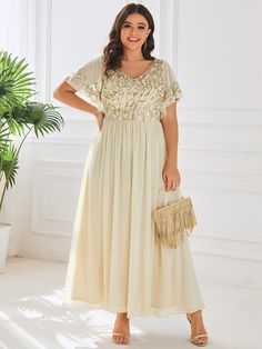 This vintage-influenced mother of the bride dress features a classic A-line silhouette. A cinched waist complements the gorgeous sequin pattern on the top with sheer, draped sleeves and a plunging v-neck and v-back. An ankle-length tulle bottom finishes the look, giving it effortless elegance. Fit: Please refer to size chart. Length: Ankle length. Sleeve Style: Short sleeves. Closure: It is concealed a zipper up the back. Undergarments: It is not padded, with lining. Fabric:The garment comprises Ruffles Sleeves, Banquet Dresses, Sequin Evening Dresses, Ankle Length Dress, Mothers Dresses, Mother Of The Bride Dress, Bride Dresses, Formal Evening Dresses, Custom Dresses