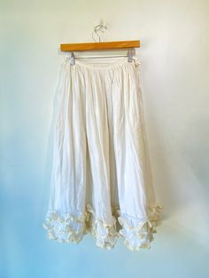 Vintage Bureaux White Ruffle Skirt! So cute! 100% cotton. Fully lined. Best fit a S/M, please refer to measurements. In overall good condition with some signs of wear throughout, and a small hole on the side. Approx. Measurements: Waist: 30" Length: 30" Fitted Cotton Bottoms With Gathered Skirt, Cotton Lined Flowy Skirt, Flowy Cotton Lined Skirt, Cotton Lined Flared Skirt, Spring Cotton Skirt With Ruffles, Cotton Flared Skirt With Lining, Cotton Full Gathered Skirt, Full Cotton Skirt With Lining, Cotton Full Skirt With Elastic Waistband