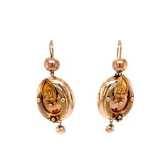 Vintage Victorian Drop Earrings 14k Yellow Gold. These whimsical 14 karat yellow gold Victorian earrings are so special. The oval drop earring features a floral motif with repousse relief metal work detail. The earrings are rather large for the time period, measuring over 2 inches in length and have great movement. Victorian earrings are sought after by many collectors as they have remained a pair for over 140 years. Ornate Yellow Gold Oval Earrings, Victorian Oval Pierced Earrings, Victorian Style Engraved Yellow Gold Earrings, Victorian Engraved Yellow Gold Earrings, Antique Gold Engraved Earrings, Victorian Oval Earrings For Collectors, Antique Engraved Drop Earrings, Collectible Victorian Oval Earrings, Gold Oval Earrings With Intricate Design