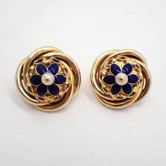 Vintage 16k (.667) yellow gold ornate round form earrings, having dark blue enamel flower centerpiece, accented with Seed Pearl. The backs are 14k (.585) yellow gold (replaced), the earrings were tested to be 16k gold. These majestic earrings are 25 mm in diameter, weighing a total 15.4 grams. EA3502 Celtic Knot Band, Flower Centerpiece, Enamel Flower, Seed Pearl, Earrings Blue, Flower Centerpieces, Floral Earrings, Sterling Ring, Vintage Watches