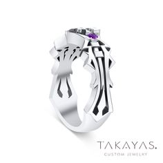 a white gold ring with an amethorate stone in the center and purple stones on