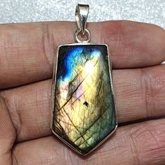 Gemstone - High Quality Labradorite Stone Size - 36x21 mm Shape - Teardrop Cut - Plain Smooth Pendant Size - 51x22 mm #4039 QTY - 1 piece in this listing. ( Sizes are close approximation ) Ring shown in the pictures are for representation purpose , actual Gemstone will vary in Shape , Size , Colour , Looks and Flash/Fire . Please send write us convo if you have any questions or need more quantity of any particular item Silver Labradorite Gemstone With Large Stone, Large Silver Labradorite Gemstones, Silver Cabochon Labradorite Gemstones, Silver Labradorite Cabochon Gemstones, Silver Labradorite Drop Jewelry, Labradorite Stone, Sterling Silver Pendant, Sterling Silver Pendants, Silver Pendant