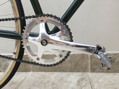 a close up of a bike with a chain on it