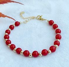 This beautiful and simple design coral red bracelet is made with 6cm bright red carol beads,  4cm 14k gold plated, and 18k gold extension. Length: 16cm with 5 cm extension.  This bracelet is ready and can be posted in 1 working day by royal mail 2nd class. It will be packed with a gift box and ready to be gifted.  More can be found:  http://www.etsy.com/uk/shop/smartsmalldesigns Red Bracelet, Red Bracelets, Coral Red, Bright Red, Gift Christmas, Arm Band, Uk Shop, Simple Design, Royal Mail