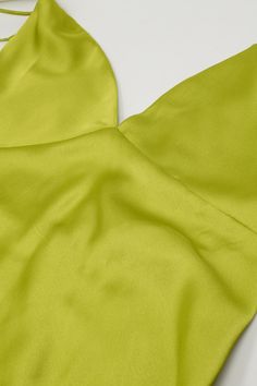 Turn heads with our Satin Maxi Dress With Spaghetti Straps in Lime Green. This lovely slip dress, made from a blend of 95% polyester and 5% elastane, offers a beautiful satin finish that adds a touch of luxury to any occasion. Designed with a V-neck neckline and spaghetti straps, this dress features an elegant A-line cut that flatters your figure. The open back and zip-back fastening add a hint of allure, making it perfect for parties and special events. The maxi length and sleeveless style ensure a comfortable and stylish fit. Key Features: Material: 95% Polyester, 5% Elastane Fit: Runs true to size, regular fit Details: Maxi length, V-neck neckline, spaghetti straps, open back, zip-back fastening, satin finish Model Info: Wearing size S. Measurements - Bust: 33", Waist: 24", Hips: 35", H Tan Scarf, Verde Lima, Dress Collar, Skirt Jumpsuit, Scarf Headband, Satin Maxi, Satin Maxi Dress, Green Satin, Romper Pants