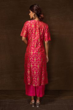 Pink banarasi silk kurta with floral pattern and side pockets. Comes with pant.
Components: 2
Type Of Work: Floral
Neckline: Round
Sleeve Type: Half
Fabric: Banarasi silk
Color: Pink
Other Details: 
Side slits on kurta
Occasion: Sangeet - Aza Fashions Round Pattern, Silk Kurta, Pant Set, Set For Women, Half Sleeve, Aza Fashion, Sleeve Type, Half Sleeves, Pants Set