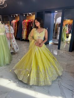 Color: Vibrant lemon yellow Fabric: Luxurious, with a soft sheen cotton silk Blouse: Sleeveless design Delicate beadwork and silver embroidery Skirt: Flowing, full-length design Intricate silver embroidery with elaborate patterns Dupatta: Matching yellow with subtle detailing Style: Perfect blend of traditional elegance with a modern twist Ideal For: Weddings, festivals, and celebratory events Customizable in other colors READY TO SHIP , Please WHATSAPP +1 (945) 444-2194 for more info. Sleeveless Yellow Lehenga For Festivals, Traditional Yellow Sleeveless Sharara, Traditional Sleeveless Yellow Sharara, Yellow Sleeveless Wedding Sets, Yellow Raw Silk Dress For Reception, Yellow Tissue Silk Traditional Wear For Reception, Elegant Yellow Embroidered Sharara, Yellow Sleeveless Dresses For Reception, Yellow Raw Silk Sets For Wedding