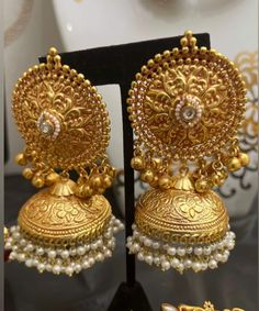 Silver/Gold Jhumka with  stone and pearl strings Big Jhumka Earrings Gold, Large Gold Jhumkas, Heavy Brass Jhumkas For Wedding, Luxury Traditional Jhumkas, Big Jhumka Earrings, Traditional Brass Jhumkas For Wedding, Luxury Gold Ornate Jhumkas, Pearl Strings, Gold Jhumka