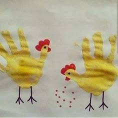 two handprints made to look like chickens