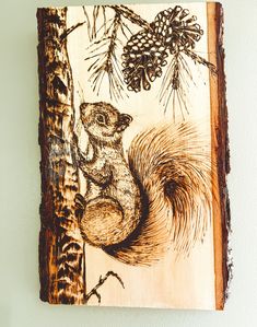 a drawing of a squirrel in a pine tree