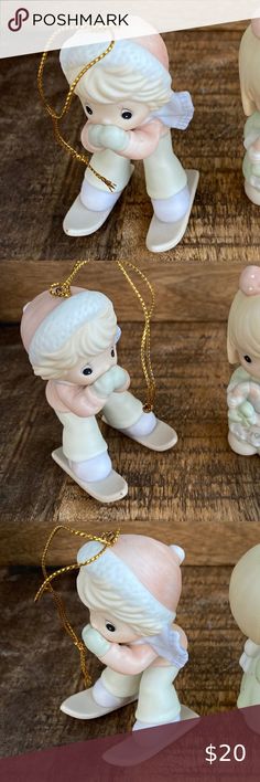 four pictures of little angel figurines with chains on them, one is white and the other is pink