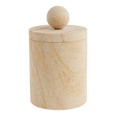 a white marble container with a ball on the top and one in the middle, against a white background