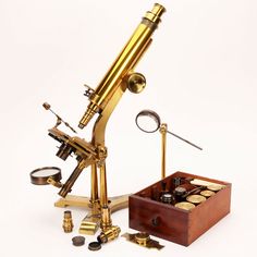 an antique microscope and other items are on display