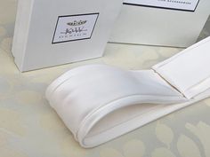 "This elegant bridal belt is inspired by the tuxedo style cummerbund belt and is beautifully hand made in silk Duchess satin. The belt is finished with the hidden clasp closure for the perfect detail. It comes in many color choices, please see the last photo for the color reference only. This belt measures 2\" wide and the length is finished to your measurements. * Please include your waist measurements in the notes during checkout and your belt will be finished at that length - For the addition Designer White Belt For Formal Occasions, Designer White Belts For Formal Occasion, Elegant Adjustable Belt For Evening, Elegant Fitted Belt With Removable Feature, Elegant Adjustable Sash For Formal Occasions, Elegant Adjustable Sashes For Formal Occasions, Elegant Formal Adjustable Sash, Fitted Chic Sashes For Formal Occasions, Elegant Formal Adjustable Sashes