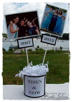 there are two pictures on top of a bucket that is decorated with white shredded paper