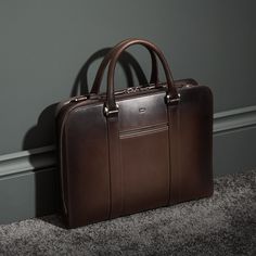 Palissy Briefcase – Patina Modern Travel Briefcase Rectangular Case, Luxury Rectangular Case Bag For Business Trips, Elegant Brown Travel Case, Modern Brown Top Handle Briefcase, Elegant Everyday Rectangular Luggage, Modern Brown Briefcase With Top Carry Handle, Luxury Rectangular Briefcase With Luggage Sleeve, Luxury Rectangular Briefcase For Travel, Elegant Rectangular Luggage For Everyday Use