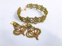 Step into a world of enchantment with this one-of-a-kind fairycore wedding choker necklace set. Handcrafted with love and care, this delicate lace necklace features metallic copper tatting that shimmers in the light and copper-lined green beads. Every inch of this necklace is a testament to its ethereal charm and Victorian-inspired design, making it the perfect accessory for your wedding day or any special occasion.  GET FREE UPGRADED SHIPPING ON ORDERS OVER $110! Each piece of Monarch lace jewe Whimsical Beaded Jewelry For Wedding, Bohemian Wedding Jewelry With Bead Caps, Fairycore Wedding, Monarch Jewelry, Wedding Choker Necklace, Copper Lace, Forest Jewelry, Elven Jewelry, Lace Necklace