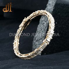 Baguette Diamond Solid 14k Yellow Gold Handmade Oval Bangle Jewelry BAMJ-199 Baguette Diamond Bangle. 14k Gold Bangle Jewelry. 14k Yellow Gold Jewelry. Handcrafted Diamond Bangle. Diamond Oval Bangle. Champagne White Diamond.  45x60 MM Bangle Size. Here Are Some Amazing Ways To Take Care Of Your Precious Diamond Jewelry. Always. * Apply lotion, cosmetics, hairspray, and perfume before dressing in jewelry. * When undressing, wipe each piece with a clean soft cloth to remove oils and perspiration. * Store in a fabric-lined box, separately or individually-wrapped in tissue to prevent scratches. Never: * Never wear jewelry when doing physical work such as housekeeping, gardening, or exercise. * Never expose jewelry or household cleaning products. * Never expose jewelry to chlorine swimming poo Gold Bangle With Baguette Diamonds, Baguette Cut Diamond Bracelets, Wedding Bangle In White Gold With Baguette Diamonds, Diamond Bangle With Baguette Diamonds For Anniversary, Wedding Diamond Baguette Cut Bangle, Wedding Diamond Bangle With Baguette Cut, Baguette Cut Diamond Bracelet For Anniversary, Baguette Diamond Bangle For Anniversary, Gold Diamond Baguette Cut Bangle