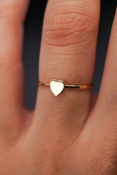 The small heart adds a lovely detail to this lightly hammered stacking ring. Each ring is handmade to order in your ring size for a perfectly customized fit. This ring makes for the perfect anniversary, birthday or valentine's day gift for your special somebody! The band measures approximately 1mm in width and features a lightly hammered finish. The Heart detail measures approximately 5mm in width. This listing is for ONE SINGLE Heart Ring in 14K GOLD FILL metal.  This ring is a great alternativ Love Valentines Day, Minimal Ring, Free Love, Tiny Rings, Hammered Band, Ring Stacking, Mini Heart, Small Heart, Favorite Rings