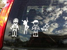 stickers on the back window of a car depicting people in different outfits and sizes