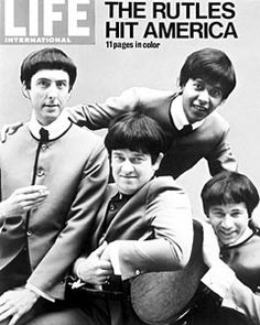 the beatles are posing for a magazine cover