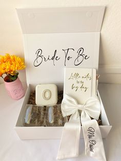 the bride to be gift box is filled with personalized items for her special day