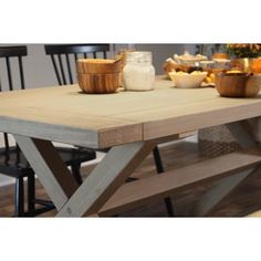 a wooden table with some bowls on it