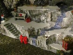 a fake snow covered mountain with presents on it