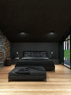 a large bed sitting on top of a hard wood floor next to a stone wall