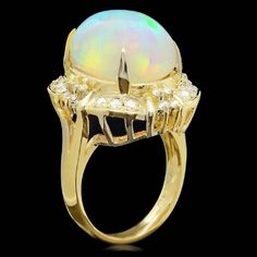 12.70 Carats Natural Impressive Ethiopian Opal and Diamond 14K Solid Yellow Gold Ring Suggested Replacement Value: $6,800.00 Total Natural Opal Weight is: Approx. 12.00 Carats Opal Measures: 18.00x 13.00mm Total Natural Round Diamonds Weight: Approx. 0.70 Carats (color G-H / Clarity SI1-SI2) Ring total weight: Approx. 10.0 grams Disclaimer: all weights, measurements and colors are approximate and may vary slightly from the listed dimensions or as seen in the image. All pictures are magnified to Emerald Cut Aquamarine Ring, Expensive Rings, Opal Band, Emerald Cut Rings, Etsy Gold Ring, Aquamarine Rings, Natural Opal, Quality Diamonds, Ethiopian Opal