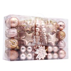 a clear box filled with lots of different colored ornament balls and snowflakes