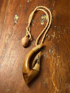 I Loved how this XL Lei Makau Hook Necklace turned out. It is beautiful. I carved it from rare Myrtle wood and Pre-historic ice-age bone. The clasp is from a Hawaiian Cyprae Cowrie shell. This one-of-a-kind fine art Hawaiian cultural piece is sure to generate conversation. Mahalo for the support. Keoni Shark Tooth Necklace, Hook Necklace, Tooth Necklace, Bone Horn, Cowrie Shell, Bones, Hippie Boho, Shells, Handmade Items