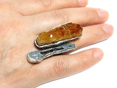 Sterling Silver RAW Citrine Gemstone Adjustable Ring, Boho Chic Trendy Large Druzy Orange Crystal Birthstone Statement Women's Ring Author's handmade One of a kind Designer open ring with natural raw citrine. Ring with a comfortable wide shank. The design makes it easy to adjust the size for your finger. The ring is quite large, immediately catches the eye. A fine piece of jewelry art. The size of the stone is approximately 50*25 mm. Weight 27 gr. ~ ~ ~ ~ ~ ~ ~ ~ ~ ~ ~ ~ ~ PLEASE READ ~ ~ ~ ~ ~ Citrine Stone Ring Jewelry, Citrine Stone Ring, Citrine Jewelry With Large Stone For Anniversary, Large Stone Citrine Jewelry For Anniversary, Citrine Jewelry With Stone Setting For Gift, Anniversary Citrine Jewelry With Natural Stones, Unique Citrine Gemstone Crystal Ring, Unique Citrine Jewelry With Stones, Citrine Healing Jewelry With Stones