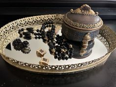 "Gorgeous vintage 1960s black bead jewelry set. Onyx-color Lucite bead necklace with gold bead spacers and two pair of earrings, bead cluster and diamond shaped black and gold enamel. Super versatile set that can be dressed up or down, worn together or separately.  Necklace is 28\" total length with spring ring style clasp. Earrings are both 1\" across with clip on fasteners. Get your gothic glam on or just add some vintage style to jeans and a sweater!" Vintage Beaded Jewelry For Party, Vintage Black Beads Necklace For Gift, Vintage Black Necklace With Oval Beads, Antique Beaded Jewelry For Formal Occasions, Vintage Jewelry With Polished Oval Beads, Vintage Oval Beaded Jewelry, Evening Jewelry With Faceted Round Beads, Vintage Black Bead Necklaces For Evening, Vintage Black Beads Necklace For Evening