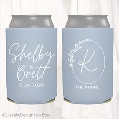 two wedding can coolers with the names and date printed on them, sitting next to each other