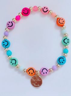 "This bracelet is handmade with love using some of our newest smiley face beads. **Please note the shipping time. This specific bracelet is a pre order, which means it will take anywhere between 1 to 2 weeks to arrive. To ensure a proper size, use a tape measure around your wrist. Place a dot where the tape measure meets. That is your wrist size! In our drop down menu, we have also included the average sizes for you. Please note we are not responsible if bracelet does not fit after providing thi Trendy Everyday Bracelet With Smiley Face, Trendy Everyday Bracelets With Smiley Face, Trendy Everyday Smiley Face Bracelet, Smiley Face Round Beads Bracelet For Gift, Smiley Face Round Beads Bracelet As Gift, Smiley Face Beaded Bracelets As Gift, Casual Adjustable Smiley Face Bracelets, Everyday Beaded Bracelets With Smiley Face, Casual Adjustable Smiley Face Bracelet