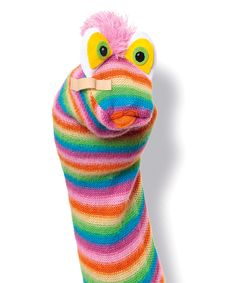 a colorful stuffed animal with big eyes and a striped scarf on it's back