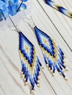 Blue Beaded Fringe Earrings For Festival, Blue Beaded Fringe Tassel Earrings For Festivals, Blue Fringe Earrings For Festivals, Bohemian Blue Earrings With Beaded Fringe, Blue Fringed Beaded Earrings For Festival, Blue Bohemian Beaded Fringe Tassel Earrings, Bohemian Blue Beaded Fringe Earrings, Bohemian Blue Dangle Tassel Earrings, Blue Bohemian Beaded Fringe Earrings