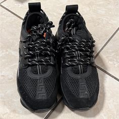 Never Worn Luxury Black Lace-up Sneakers, Designer Black Sneakers With Boost Midsole, Luxury Black Lace-up Custom Sneakers, Designer Black Sneakers With Vibram Sole, Luxury Black Custom Sneakers With Studded Outsoles, Versace Chain, Versace Sneakers, Versace Shoes, Chain Reaction