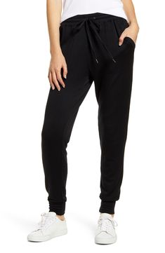 Supersoft and stretchy, these joggers have a slim yet relaxed fit that feels right at home in your casual wardrobe. 27 1/2" inseam Elastic/drawstring waist Front slant pockets 95% modal, 5% spandex Machine wash, tumble dry Made in the USA t.b.d. Leisure Pants With Ribbed Waistband, Sporty Elastane Pants For Loungewear, Black Activewear For Lounging, Black Athleisure Joggers For Lounging, Casual Mid-rise Joggers For Loungewear, Leisure Straight Leg Stretch Joggers, Black Activewear For Lounging With Elastic Waistband, Black Activewear With Elastic Waistband For Lounging, Stretch Straight Leg Joggers For Leisure