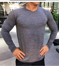 Compression Rashguard Men’s Gym & Sports Long Sleeve T Shirt Sporty Long Sleeve T-shirt With Go-dry Technology, Sporty Long Sleeve Go-dry T-shirt, Long Sleeve Athleisure T-shirt For Running, Gray Crew Neck Activewear Sportswear, Gray Long Sleeve T-shirt For Workout, Athleisure Long Sleeve Go-dry T-shirt, Gray Athletic Fit Crew Neck Activewear, Gray Crew Neck Top For Light Sports, Breathable Athletic Heather Activewear With Crew Neck