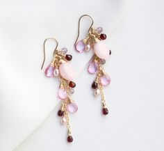 A beautiful and romantic addition to your accessory collection. Each earring features mixed of different colour gemstones (pink Opal, mystic pink Topaz, red Garnet, pink Amethyst, and Pink Pearl), gradually hand wrapped in 14k gold filled, and dangling from a 14k gold-filled ear hook. P R O D U C T * D E T A I L S Metal - 14K gold filled Stone -  Pink Opal, mystic pink Topaz, red Garnet, pink Amethyst, and Pink Pearl Colour - Multi colours (Pink and red) Stone Size - Range from 3-9 mm Earring Si Wire Jewellery, Ocean Jewelry, Jewelry Picture, Pink Topaz, Gemstone Jewelry Handmade, Pink Amethyst, 925 Silver Jewelry, Ear Hook, Red Stone