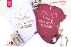 two t - shirts that say, i'm getting here and meowied