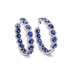 Stylish hoop 18k white gold earrings with blue sapphires and diamonds. Sapphires are round cut Ceylon blue gems 13.58 ct total. Accented by white round diamonds 3.98 ct in total. Diamonds are white and natural and in G-H Color Clarity VS. 18k white gold Length: 3 cm diameter Weight: 15 g [shortcode] [video] [/video] [/shortcode] Sapphire Hoop Earrings, Sapphire Jewellery, Blue Sapphire Earrings, Blue Sapphire Jewelry, Diamond Tops, White Gold Hoop Earrings, Platinum Bracelet, White Gold Hoops, Platinum Earrings