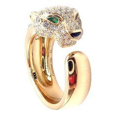 Cartier Panther 18k Yellow Gold Diamond Emerald Onyx Band Ring Paper  This ring comes with service paper from Cartier store in NYC. Retail Price: $24,300  Metal: 18k Yellow Gold Measurements:  Width: 11mm Weight: 13.2 grams Stones: Round brilliant cut diamonds VVS1 clarity, E color total weight approx. 1.15ct.  Ring Size: European 52 US 6 Hallmarks: Cartier 750 52 369XXX (serial number omitted)  Dimensions reference the ring size and are not specific to the ring itself. Luxury Cartier Rings For Formal Occasions, Formal Cartier 14k Gold Diamond Ring, Cartier 14k Gold Diamond Ring For Formal Occasions, Luxury Yellow Gold Emerald Ring With Polished Finish, Cartier 14k Gold Fine Jewelry Diamond Ring, Cartier 14k Gold Luxury Diamond Ring, Cartier Formal Fine Jewelry Rings, Cartier 14k Gold Rings For Formal Occasions, Luxury Cartier 14k Gold Diamond Ring