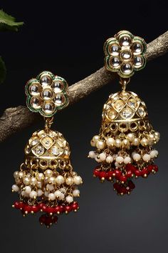 Product Features: Color: Red, Gold, Cream Base Material: Sterling Silver Plating: Gold-Plated Gemstones Used: Kundan, American Diamonds, Pearls, Natural Stones Size: Freesize Dimension: Length of Earring= 6 CM; Width of Earring =2.5 CM; Adjustable - No Occasion: Party Product Type: Jhumka Earrings Disclaimer: There will be slight difference in digital to actual image Luxury Red Chandbali Bridal Earrings, Luxury Red Traditional Earrings, Luxury Red Kundan Jhumkas, Luxury Ruby Meenakari Jhumkas, Luxury Traditional Ruby Jhumkas, Luxury Fusion Style Festive Jhumkas, Cheap Festive Chandbali Jhumkas, Luxury Ruby Temple Jewelry Jhumkas, Reception Sarees