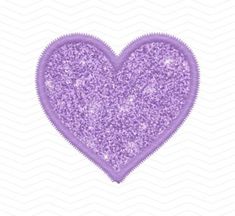 a heart shaped purple glitter with a zipper in the middle